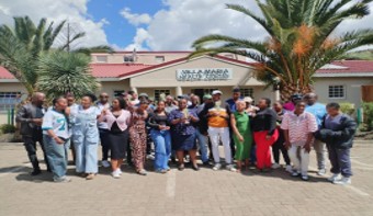 Staff and community members outside Villa Maria Health Centre